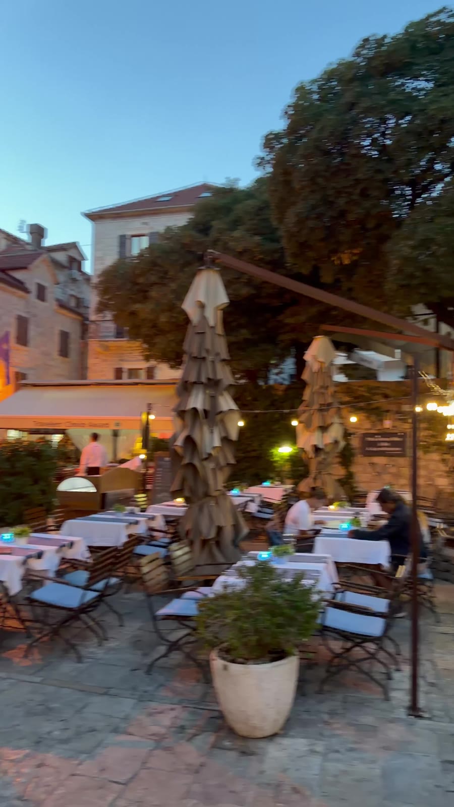Restaurant terrace in Kotor old town at dusk