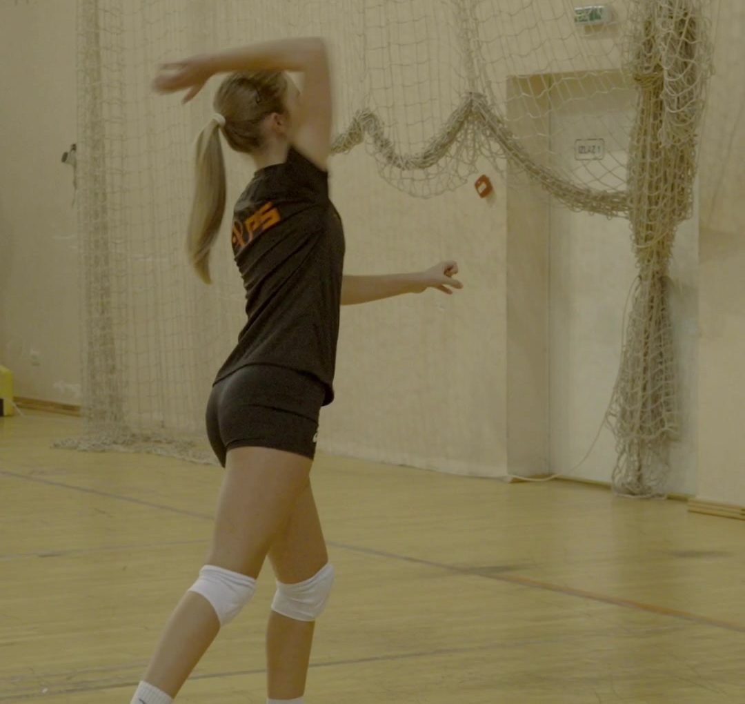 Player tossing the ball for a serve